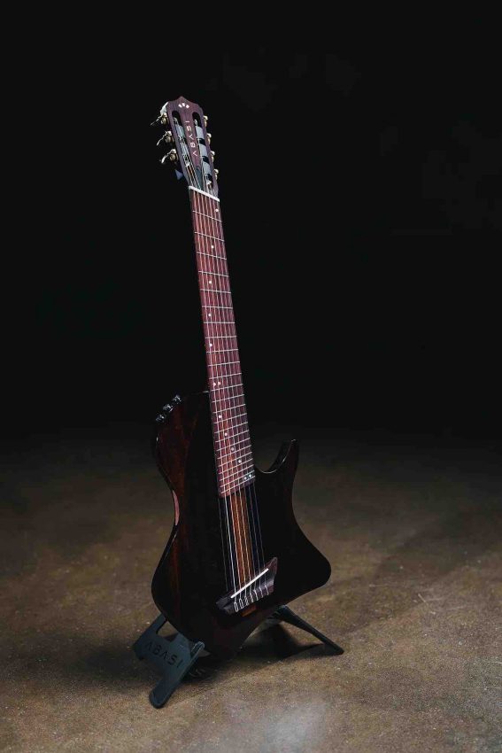 Abasi Concepts and Córdoba Stage 7-string nylon-string electric guitar featuring a chambered mahogany body with a solid spruce top in a Ziricote finish.
