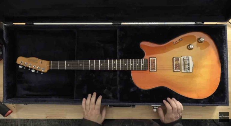 A Belltone BC4 electric guitar in its hardshell case, showing the instrument Phillip McKnight was ordered to return under legal threat.