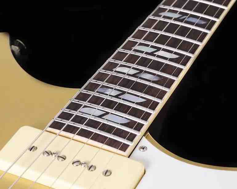 Close-up of the custom-voiced P90 pickups and Honey Gold finish on the Yamaha RS02CB Chris Buck signature guitar.