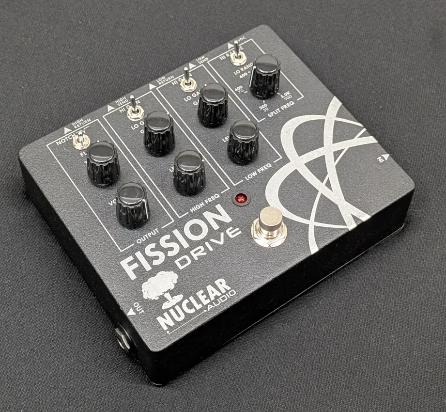 Nuclear Audio Fission Drive boutique effects pedal featuring dual-channel controls for high and low frequencies, independent gain knobs, and integrated effects loops.
