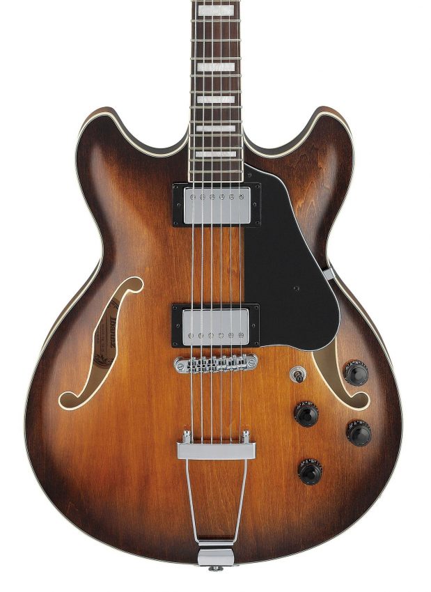 Close-up of the Ibanez AS7328 body featuring dual Classic Elite humbucker pickups, a Gibraltar Performer bridge, and a vintage-style VT06 trapeze tailpiece.