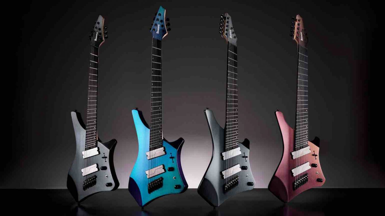 Sleek, multi-scale Ibanez Alpha A527 7-string and A528 8-string electric guitar in a radical body shape, featuring a 5-piece Parallel Wizard neck and Fishman Fluence pickups for NAMM 2026.