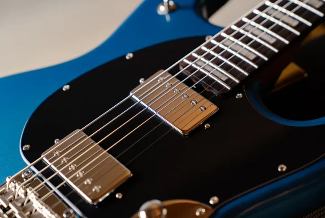 Close-up of the Toluca Lake Blue StingRay Baritone body with dual ceramic humbuckers and vintage-style tremolo bridge.