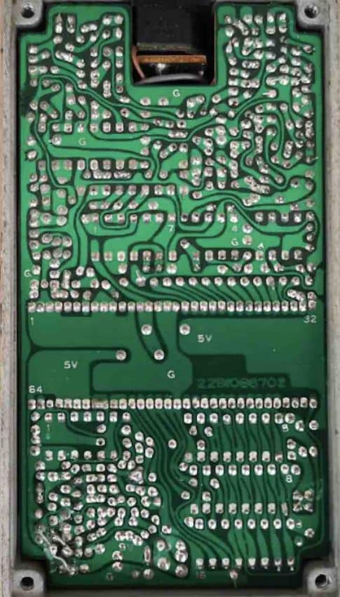 Internal circuit board of a vintage Made in Japan BOSS DD-3 featuring the iconic RDD63H101 long chip.