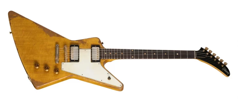 Gibson Leo Scala Master Artisan '58 Addiction Explorer guitar in aged Korina finish with gold hardware.