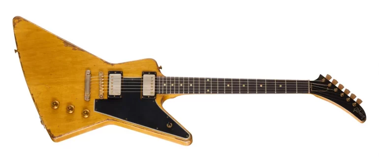 Gibson Leo Scala Master Artisan '58 Addiction Explorer guitar in aged Korina finish with gold hardware.