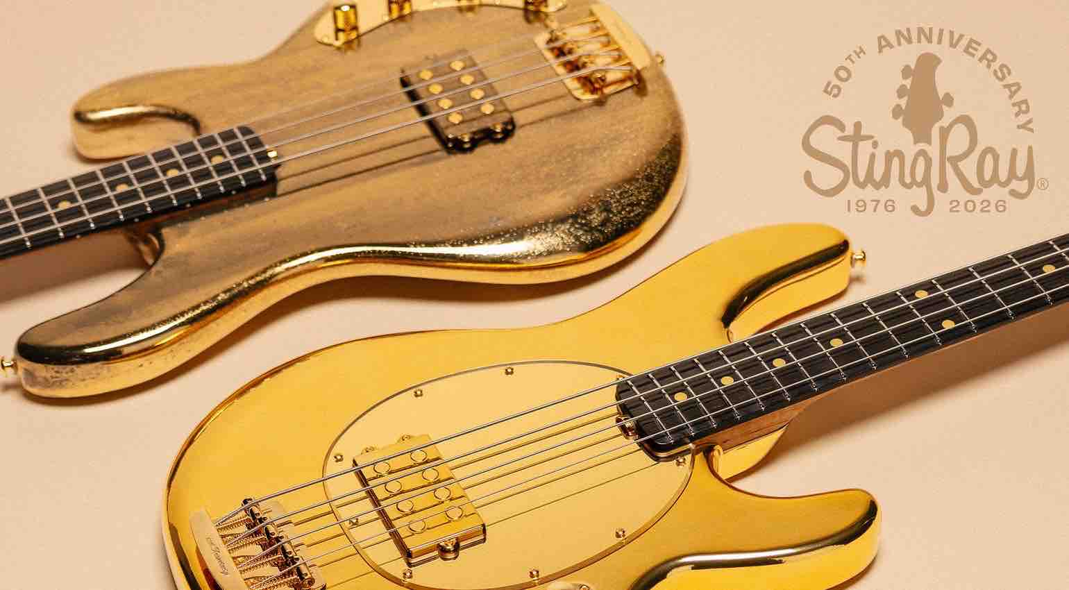 Ernie Ball Music Man 50th Anniversary StingRay bass guitar in limited-edition Liquid Gold finish with a reflective gold pickguard and Molten Gold finish showing the matching headstock and gold hardware.