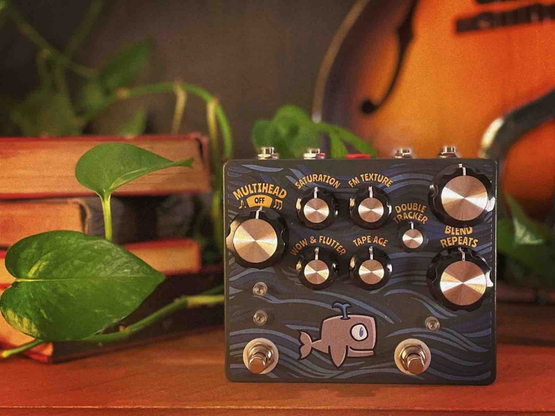 Hungry Robot Moby Dick rebooted tape delay pedal in a white UV-printed enclosure featuring a minimalist whale illustration and six control knobs.