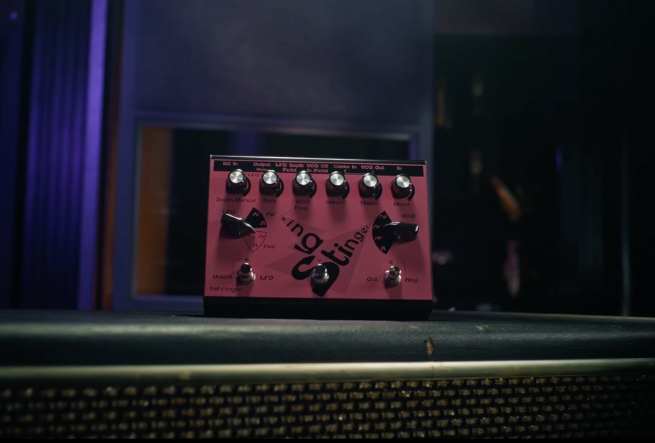 Top-down view of the Behringer Ring Stinger effects pedal, featuring its metallic chassis, multiple control knobs for LFO and VCO, and three footswitches for Octave, Bypass, and LFO.