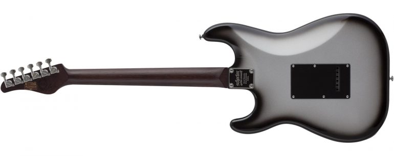 Schecter Nick Johnston Signature Traditional HH electric guitar in Atomic Mercury silver burst finish featuring a wenge neck, ebony fretboard, and dual Atombucker pickups.
