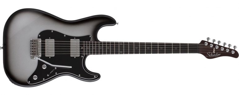 Schecter Nick Johnston Signature Traditional HH electric guitar in Atomic Mercury silver burst finish featuring a wenge neck, ebony fretboard, and dual Atombucker pickups.