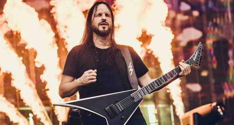 Jackson Pro Plus Series Signature Christian Andreu Rhoads RR24 EVTN6 guitar in Black with White Bevels, featuring an offset V-shape body, EverTune F6 bridge, and single Fishman Fluence humbucker.
