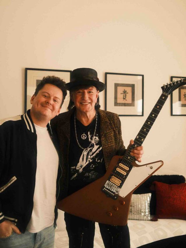 Richie Sambora holding his recovered 1976 Gibson Explorer guitar alongside Matthieu Lucas of Matt's Guitar Shop.